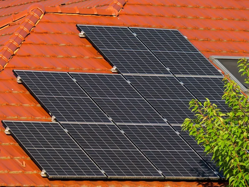 Solar panel array on a red tile residential roof in Escondido